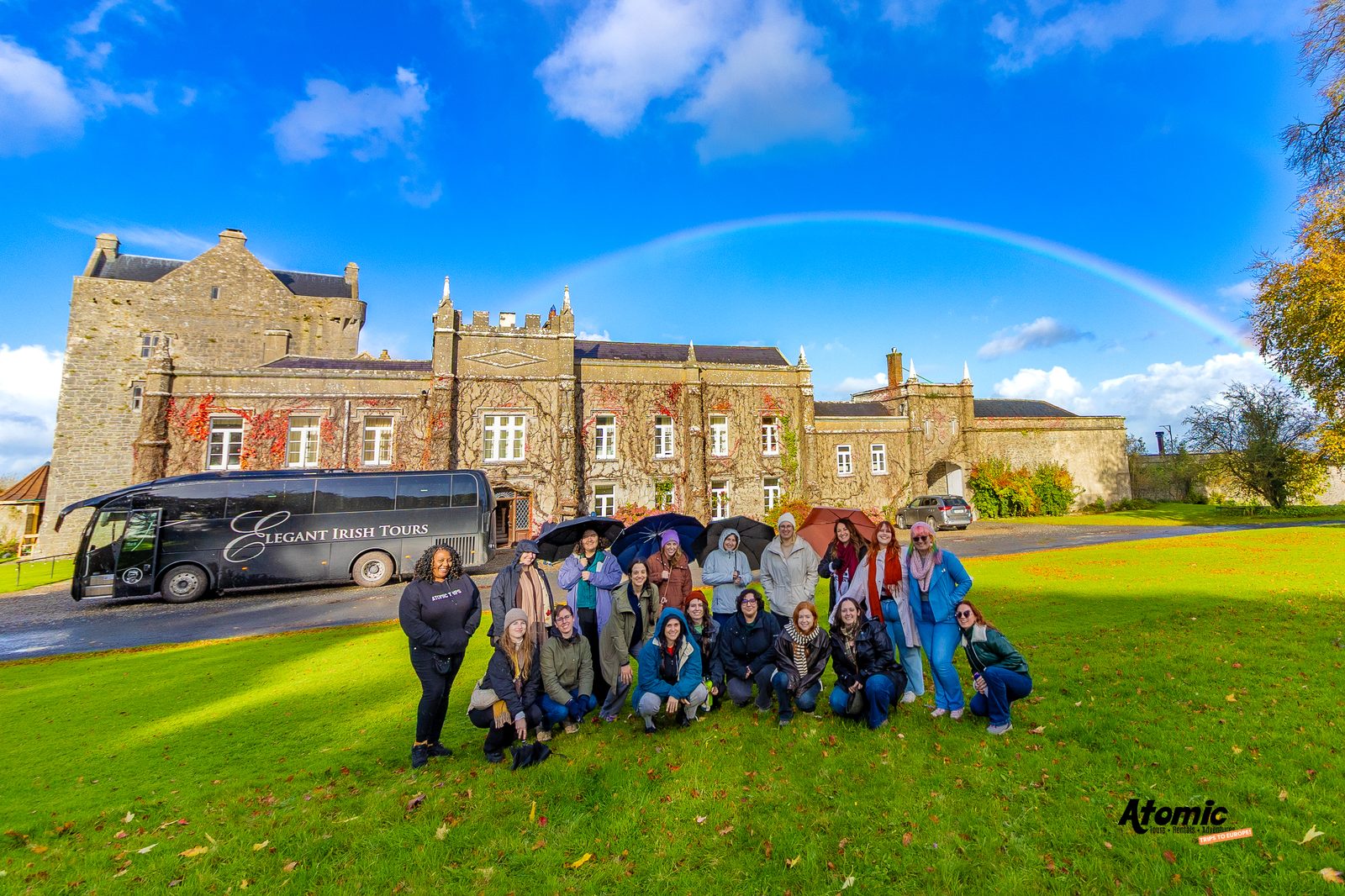 The full Atomic Trips group outside a castle in Ireland