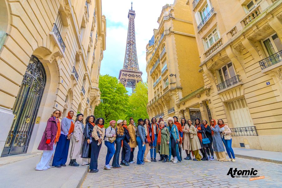 The Atomic Trips group on a Paris street below the Eiffel Tower